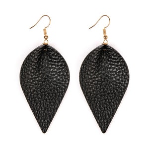 May include: A pair of black leaf-shaped earrings with gold-colored hooks. The earrings have a textured surface, resembling leather. The design is simple and elegant, suitable for various occasions.