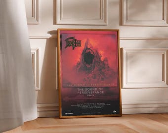 May include: A framed poster featuring the album art for "The Sound of Perseverance" by Death. The artwork depicts a dark, ominous figure with an open mouth against a red and black background. The poster is displayed on a wooden floor.