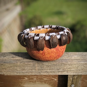 Vibrant Gourd Bowl with Hickory Husks
