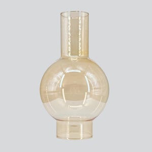 May include: A clear, amber-colored glass vase with a bulbous body and a cylindrical neck. The vase has a wide base and a smooth, reflective surface, suitable for home decor.