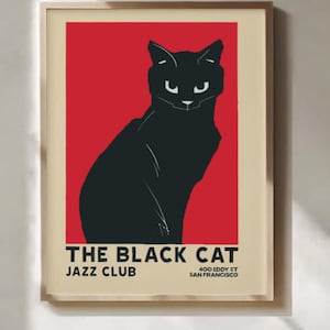 Könnte beinhalten: Gerahmtes Poster mit einer schwarzen Katzen-Silhouette vor rotem Hintergrund. Der Text "THE BLACK CAT JAZZ CLUB" und die Adresse "400 Eddy St San Francisco" sind enthalten. Das Kunstwerk befindet sich in einem Holzrahmen.