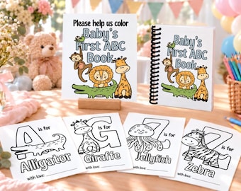 May include: A set of Baby's First ABC Book coloring pages and a spiral-bound book featuring illustrations of a monkey, lion, giraffe, and alligator. Individual sheets show letters A, G, J, and Z with animal drawings and the text 'is for'.