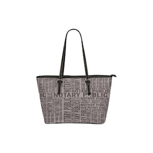 May include: A black tote bag with a zipper closure and black handles. The bag is made of a fabric with a repeating pattern of the words "Notary Public" in gray.