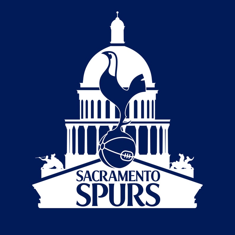 May include: White silhouette of a rooster with a basketball in its talons, standing in front of a white building with columns. The building is topped with a dome. The text "Sacramento Spurs" is below the building.