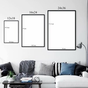 May include: Three framed art prints of varying sizes are displayed on a white wall. The prints are in black frames. The smallest print measures 30.5cm x 45.5cm, the medium print is 40.5cm x 61cm, and the largest is 61cm x 91.5cm. A sofa is below.