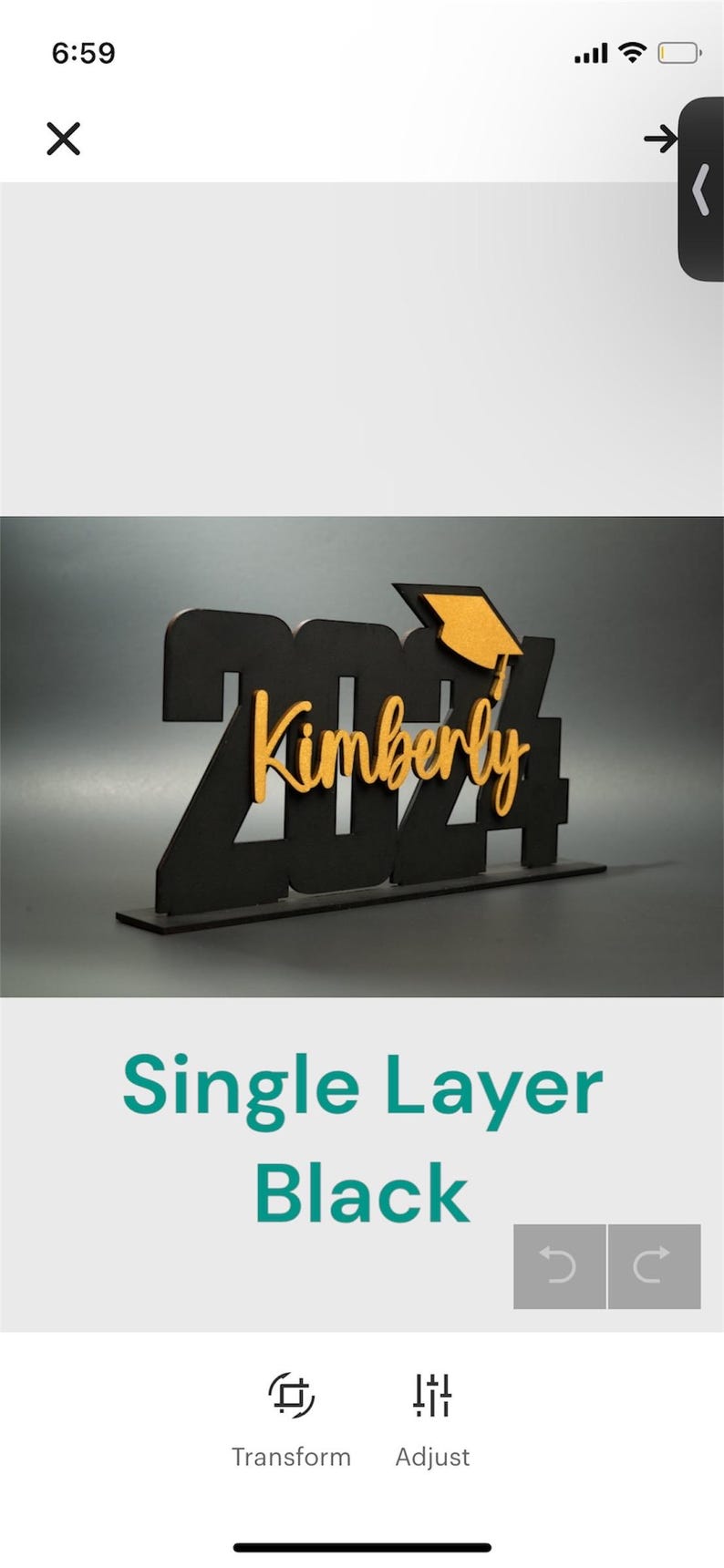 May include: Black wooden 2024 graduation sign with a gold graduation cap and the name Kimberly. The sign is on a white background.