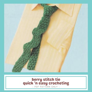 May include: A green crocheted tie with a textured berry stitch lies on a yellow button-down shirt. The tie is knotted and appears handmade. The image includes the text "berry stitch tie quick 'n easy crocheting - PDF PATTERN ONLY -."