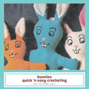 May include: Three crocheted bunny toys in orange, blue, and white are shown. Each bunny has large ears, a pink nose, and a smiling mouth with two teeth. The text "bunnies quick 'n easy crocheting" is at the bottom.