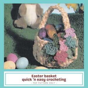 May include: A beige crocheted Easter basket filled with colourful eggs and decorative flowers. The basket has a woven handle and is decorated with green, pink, and blue crocheted flowers. The image includes the text "Easter basket quick 'n easy crocheting - PDF PATTERN ONLY -."