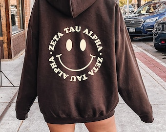 Zeta Tau Alpha Smile Sorority Sweatshirt | Trendy Zeta Custom Sorority Hoodie | Available in Brown Black Green Blue & Pink