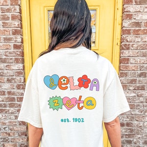 Delta Zeta Fun Doodle Scrapbook T-Shirt | Dee Zee Trendy College Greek Custom Oversized Shirt | Big Little Sorority T Shirt