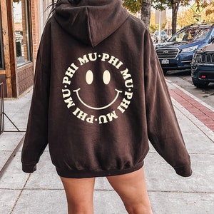 Phi Mu Smiley Sorority Sweatshirt | Trendy Phi Mu Custom Sorority Hoodie | Available in Brown Black Green Blue & Pink