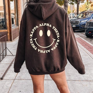 Kappa Alpha Theta Smile Sorority Sweatshirt | Trendy Theta Custom Sorority Hoodie | Available in Brown Black Green Blue & Pink