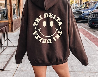 Delta Delta Delta Smiley Sorority Sweatshirt | Trendy Tri Delta Custom Sorority Hoodie | Available in Brown Black Green Blue & Pink