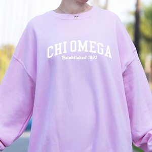 Chi Omega Sorority Varsity College ChiO MadHappy Local Optimist Crewneck Sweatshirt in Brown Tan Baby Blue or Pink