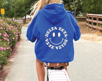 Delta Zeta Smiley Sorority Sweatshirt | Trendy Dee Zee Custom Sorority Hoodie | Available in Brown Black Green Blue & Pink