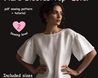 May include: A white top with flare sleeves, presented as a PDF sewing pattern and tutorial titled Flare Sleeves Top Ester. The graphic includes a pink heart icon with the text 2 Sewing level, and lists included sizes from XS to 2XL.