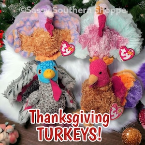 May include: Four plush turkey toys in various colors, including orange, pink, blue, and purple. Each turkey has a unique design and a heart-shaped tag. The image includes the text "Thanksgiving TURKEYS!"