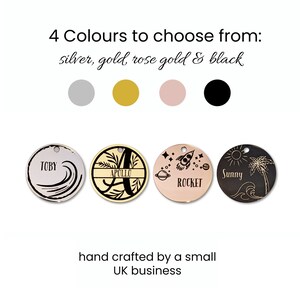 May include: A selection of four round metal tags in silver, gold, rose gold, and black. Each tag features a unique design, including a name with waves, a letter with a floral border, a rocket, and a sun with a palm tree. Text on the image reads "4 Colours to choose from: silver, gold, rose gold & black."