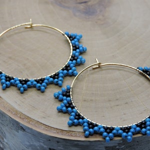 Handmade Teal and Black Hoop Earrings - Unique and Stylish Accessories. Fashioned on gold stainless steel hoops