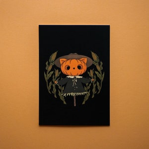 Carte postale Épouvantail de chat de maïs - Carte de voeux d’Halloween avec un épouvantail de chat mignon, décor de saison effrayant, idée cadeau automne octobre