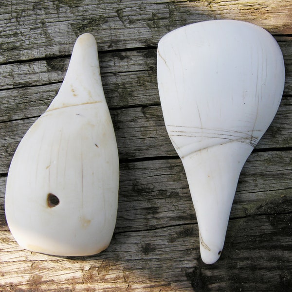 Two Antique Naga Shell Pendants