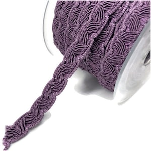 May include: A spool of purple braided trim with a decorative woven pattern. The trim is approximately 1/2 inch wide.