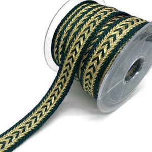 May include: A spool of green and gold chevron patterned ribbon. The ribbon is woven with a textured, herringbone pattern.