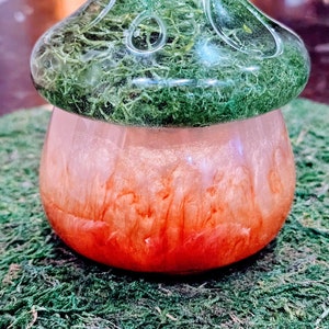 Adorable resin mushroom jar with moss filled lid