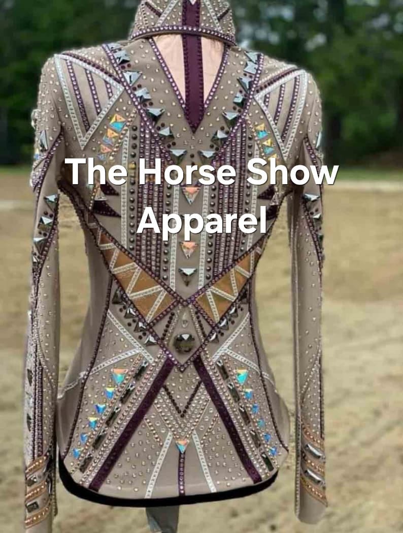 May include: A beige show shirt with a geometric design featuring white, brown, and purple accents. The shirt is embellished with rhinestones and has a high collar. The text "The Horse Show Apparel" is printed on the back of the shirt.