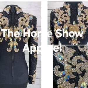 May include: Black show jacket with gold and iridescent rhinestone embellishments. The jacket features a floral design and the text "The Horse Show Apparel" on the front.