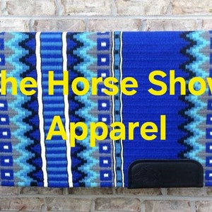 May include: A blue and white patterned horse saddle pad with the text "The Horse Show Apparel" in yellow.