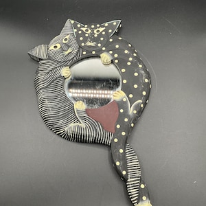 Vintage handspiegel met strepen en stippen