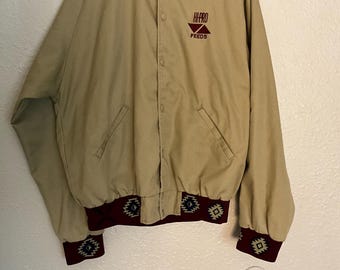 Chaqueta bomber vintage estilo azteca del suroeste en color canela con broches y forro a cuadros. Talla única.