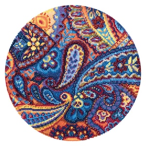 May include: A round, colourful fabric with a paisley pattern in shades of blue, red, yellow, and orange. The fabric is woven with a variety of textures and patterns, creating a visually interesting and intricate design.