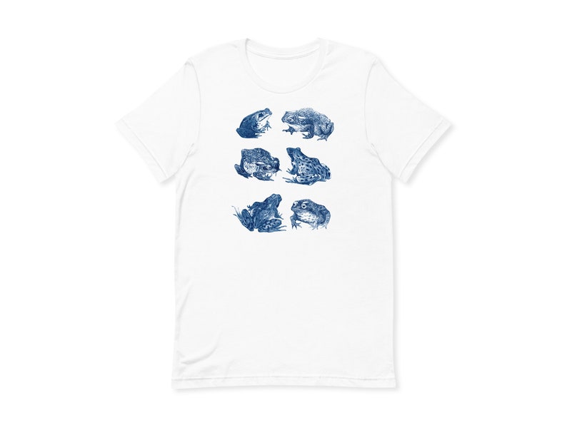 K&ouml;nnte beinhalten: Wei&szlig;es T-Shirt mit einem blauen Aufdruck von sechs Fr&ouml;schen in verschiedenen Posen.