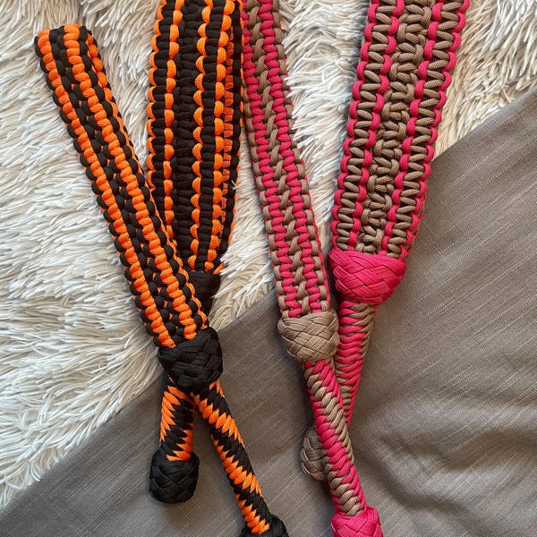 Belt paddle. smacky paddle. soft. firm. paracord paddle. woven paddle. swink shop. impact play. bdsm. kink.
