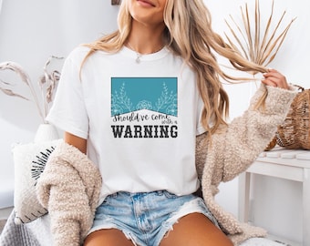 Had met een waarschuwings-T-shirt moeten komen