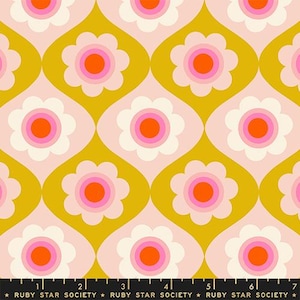 May include: A fabric pattern featuring repeating stylised flowers with orange centres, pink rings, and cream petals set against a mustard yellow background with curved shapes. A black ruler at the bottom shows 17.78 cm of length with Ruby Star Society text.