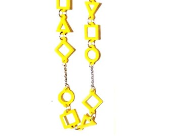 3D printed (PLA) earrings, bracelet and necklace. Yellow geometric figures.