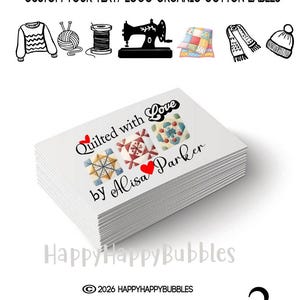 May include: A stack of rectangular organic cotton labels featuring the text Quilted with Love by Alisa Parker with three colorful quilt block illustrations and a red heart. The top includes icons of a sweater, yarn, thread, sewing machine, quilt, scarf, and hat.
