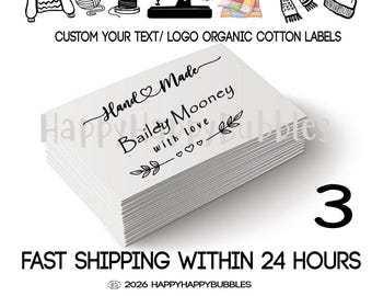 May include: A stack of white rectangular organic cotton labels featuring black printed text that reads Hand Made, Bailey Mooney, and with love, decorated with small heart and leaf icons. Above the stack are icons of clothing and sewing tools.