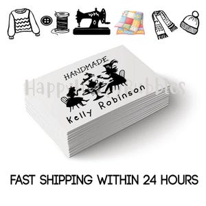 May include: A stack of white rectangular business cards featuring a black silhouette graphic of a tea party scene with the text HANDMADE and Kelly Robinson. Above the cards are small black line icons of a sweater, button, spool, sewing machine, quilt, scarf, and beanie.