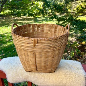 Vintage wicker rattan basket 14” tall 16” wide