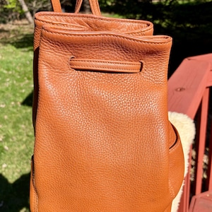 coach 1941 backpack Black Hitch – BlackSkinny Refined pebble leather and smooth calf leather Two separate main compartments with zip closures Inside zip cell phone and multifunction pockets Fabric lining Top handle with 2 1/2 drop Outside zip pocket Adjustable shoulder straps 12 1/2 (L) x 16 3/4 (H) x 6 (W) Style No. Hitch Backpack | Bags |