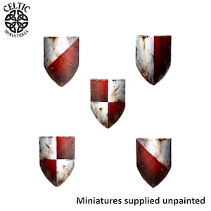 May include: Five miniature heater shields featuring a weathered red and white paint scheme. The shields display various patterns including diagonal splits and quartered designs with visible distressed textures and scratches. Text reads Celtic Miniatures and Miniatures supplied unpainted.
