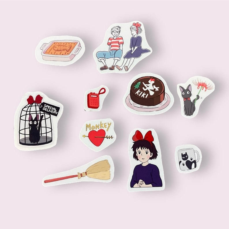 May include: A set of nine stickers featuring characters and objects from the animated film Kiki's Delivery Service. The stickers include Kiki, Jiji the black cat, a cake with the word "KIKI" on it, a broom, a red phone, a heart with an arrow, a cage with Jiji inside, a couple sitting on a bench, and a black cat with a red flower.