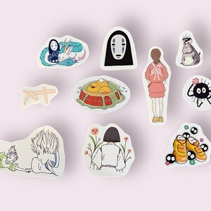 May include: A set of ten stickers featuring characters and imagery from the animated film Spirited Away. The stickers are printed on white paper and feature a variety of colors, including black, white, red, blue, green, and yellow.