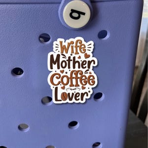 May include: White sticker with brown text that reads "Wife Mother Coffee Lover" with small hearts and a coffee bean graphic.