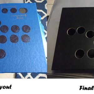 Puede incluir: Una superficie azul con un diseño propuesto de 17 círculos marcados con un marcador negro. El producto final es una caja de madera negra con 17 agujeros cortados en el mismo patrón que el diseño propuesto.